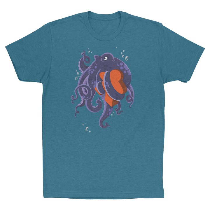 A photo of a teal t-shirt, with a picture of an octopus holding a wooden, orange board piece shaped like a person.