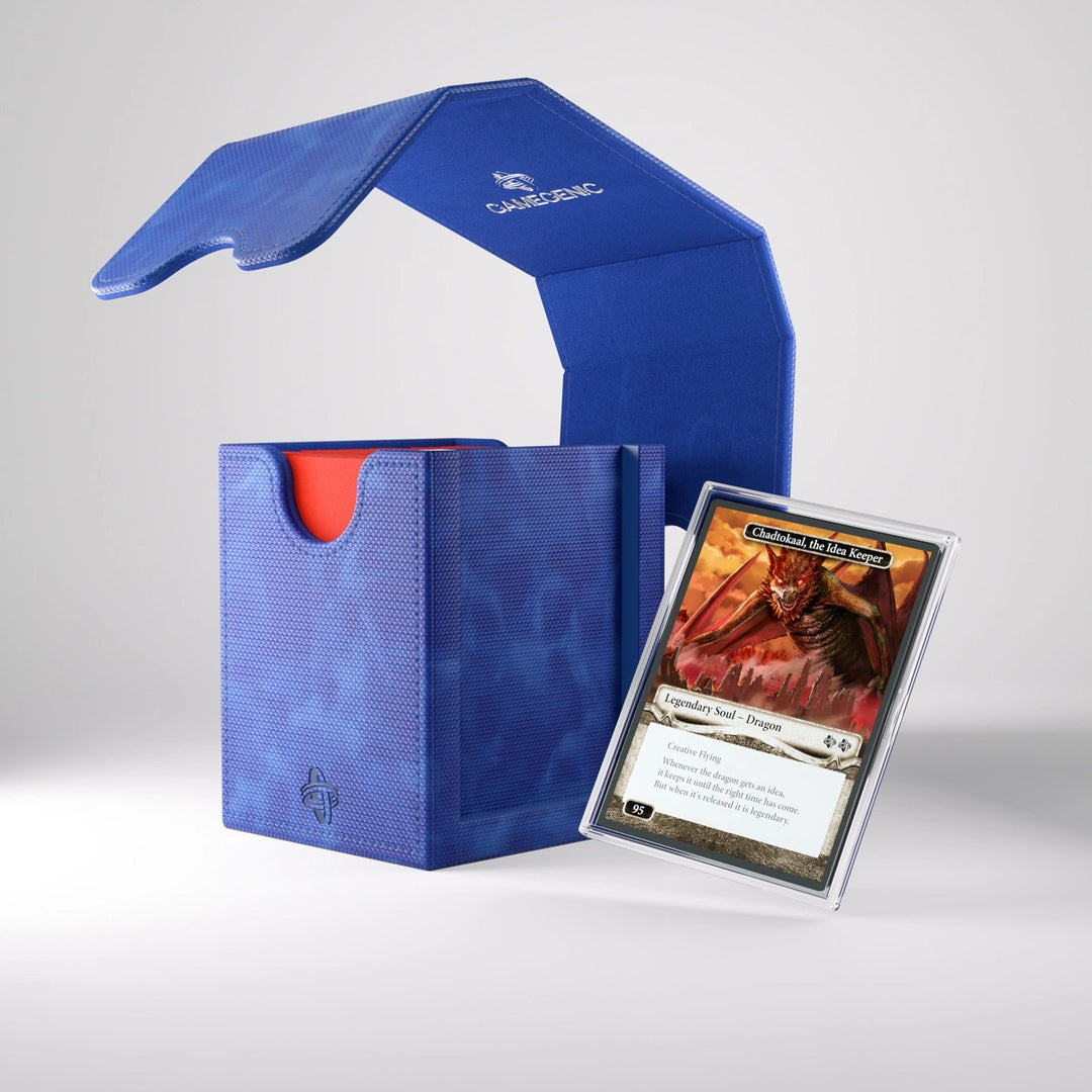 A photo of a blue, fabric box on a white background. The box is filled with cards and one card is floating to the side of box, after being removed from an insert slot on the side. The lid is removed and floating in midair above the box.