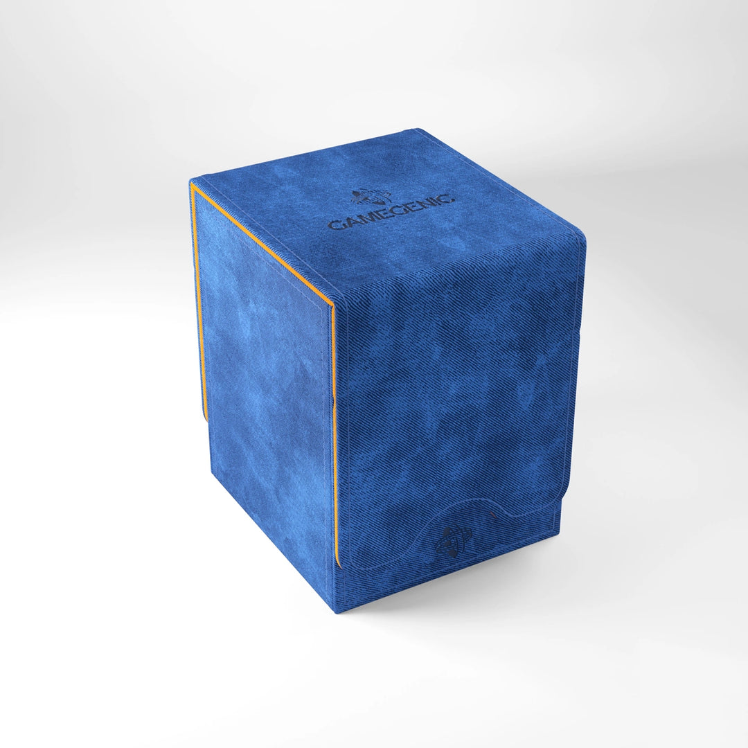 A photo of a blue, fabric box with orange trim on a white background with the lid closed.