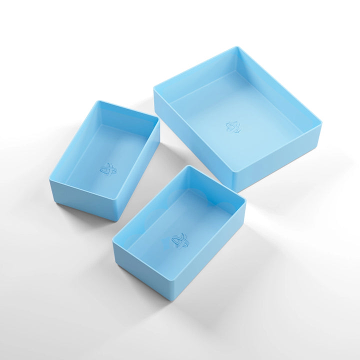A photo of three, light blue, plastic containers, two small and one large, on a white background.