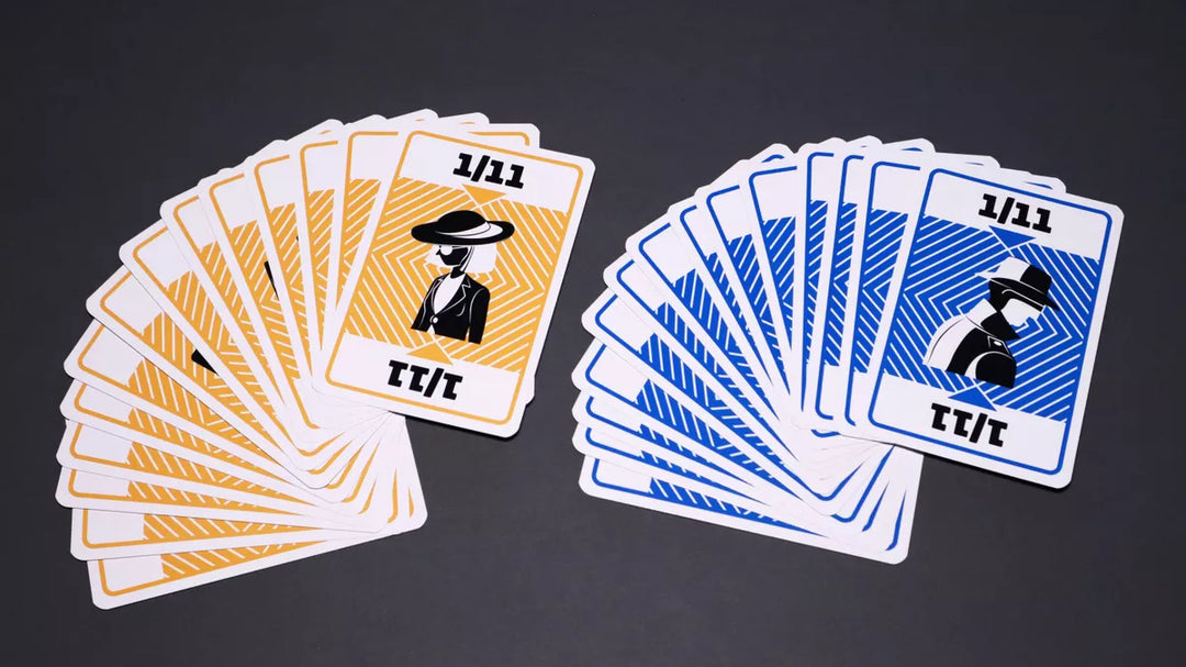 A photo of two fanned displays of cards from the board game Kompromat. Each pile is similar, with a stylized illustration of a person in black and white and the numbers 1/11 at the top and bottom. The background color of one pile is orange and the background color of the other pile is blue.