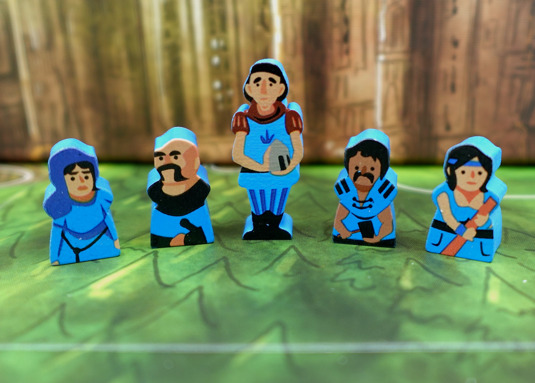 A close up photo of five wooden people tokens made from wood, with faces and clothes painted on one side, and the sides painted blue.