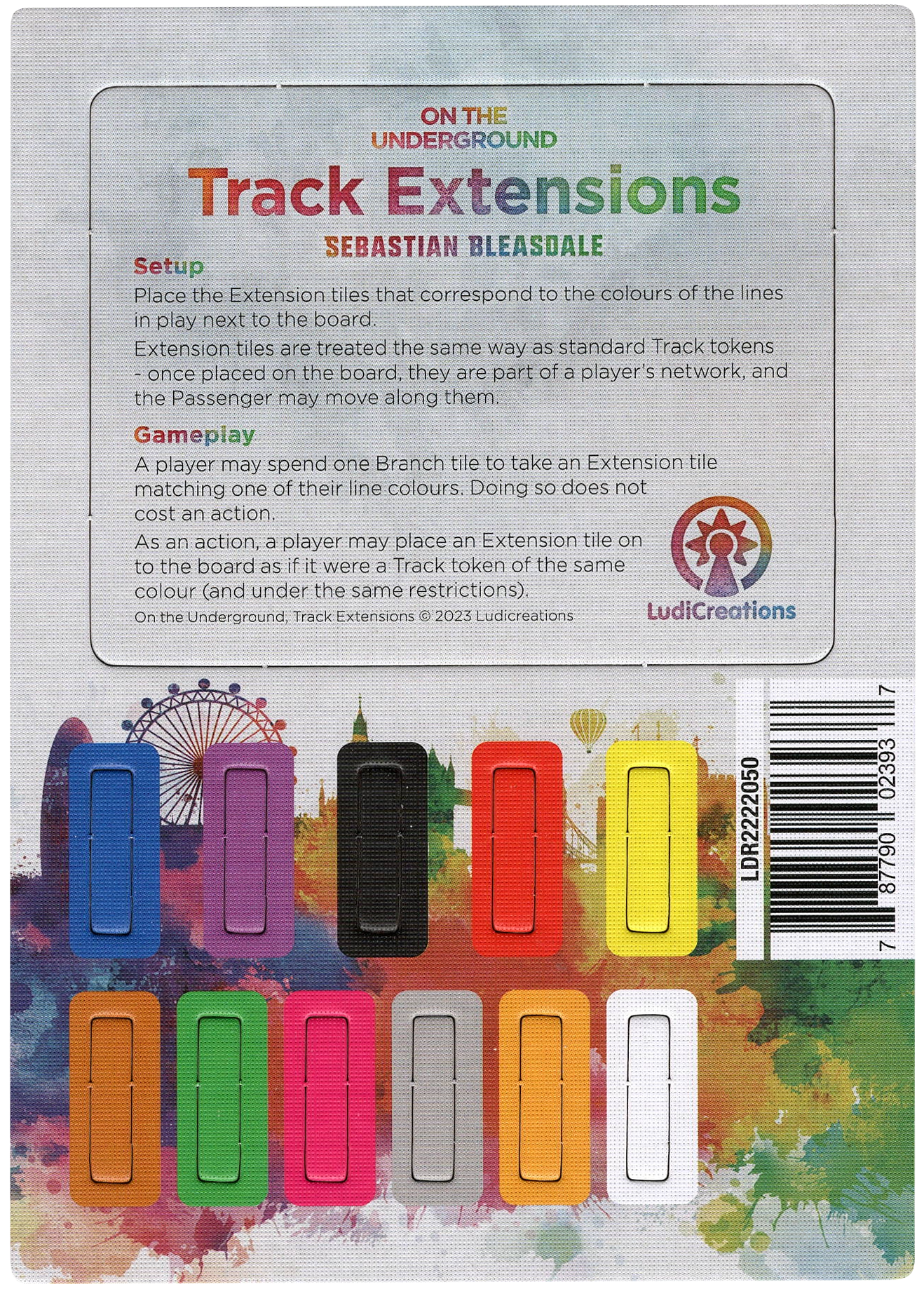 An overhead view of a punchboard for the promo Track Extensions, for use in the board game On The Underground. This punchboard as the promo's title at the top, a text description of the promo's use in the game, and then 11 solid-colored rectangles in a variety of colors that can be punched out at the bottom.