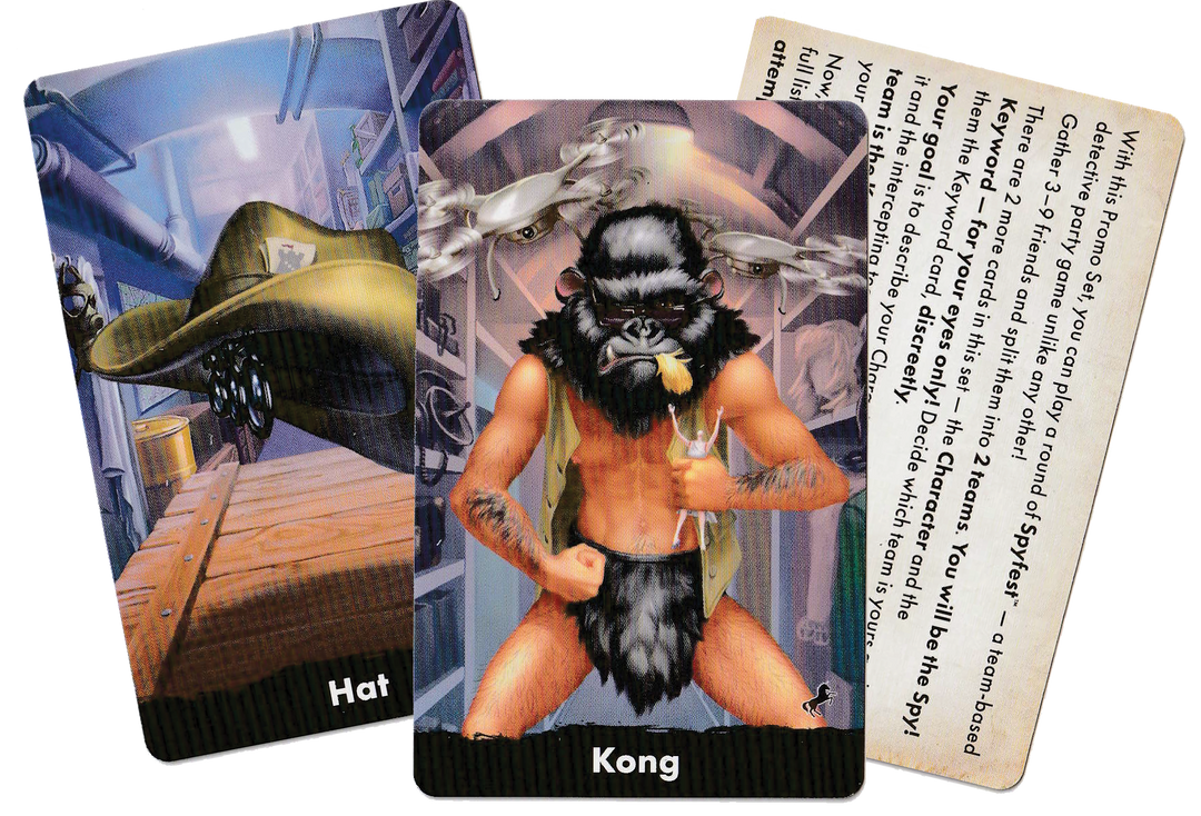 A set of three cards for use with the board game Spycon. The first card features an illustration of a hat, the second card features an illustration of a man wearing a gorilla mask and fur loincloth, and the third card contains text instructions for the promo's use.