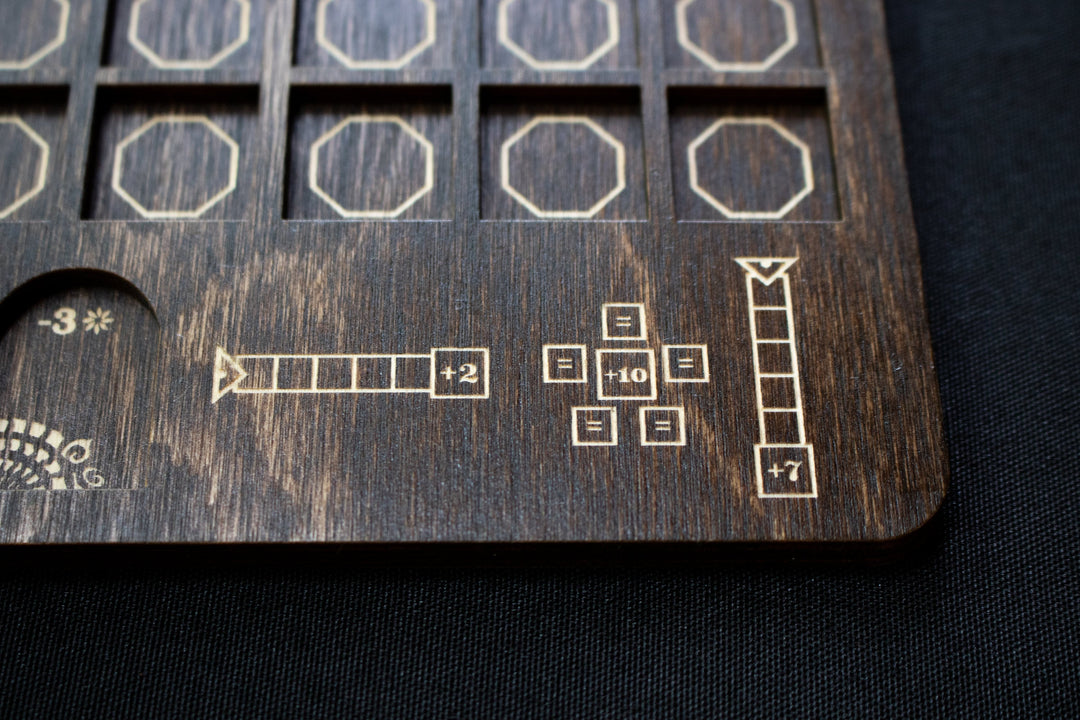 A close up photo of a wooden player board for the board game Azul, created by Strata Strike, featuring a laser cut pictorial description of the points scored at the end of the game.