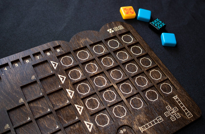 A closeup photo of a wooden player board for the board game Azul, created by Strata Strike, featuring the recesses carved into the wood to hold the game pieces in place.