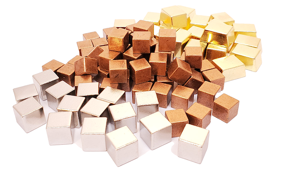 A pile of silver, copper, and gold metal cubes on a white background.