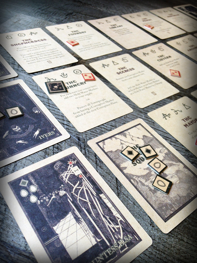 A layout of various cards from the board game The Draugr, laid out on a blue background.