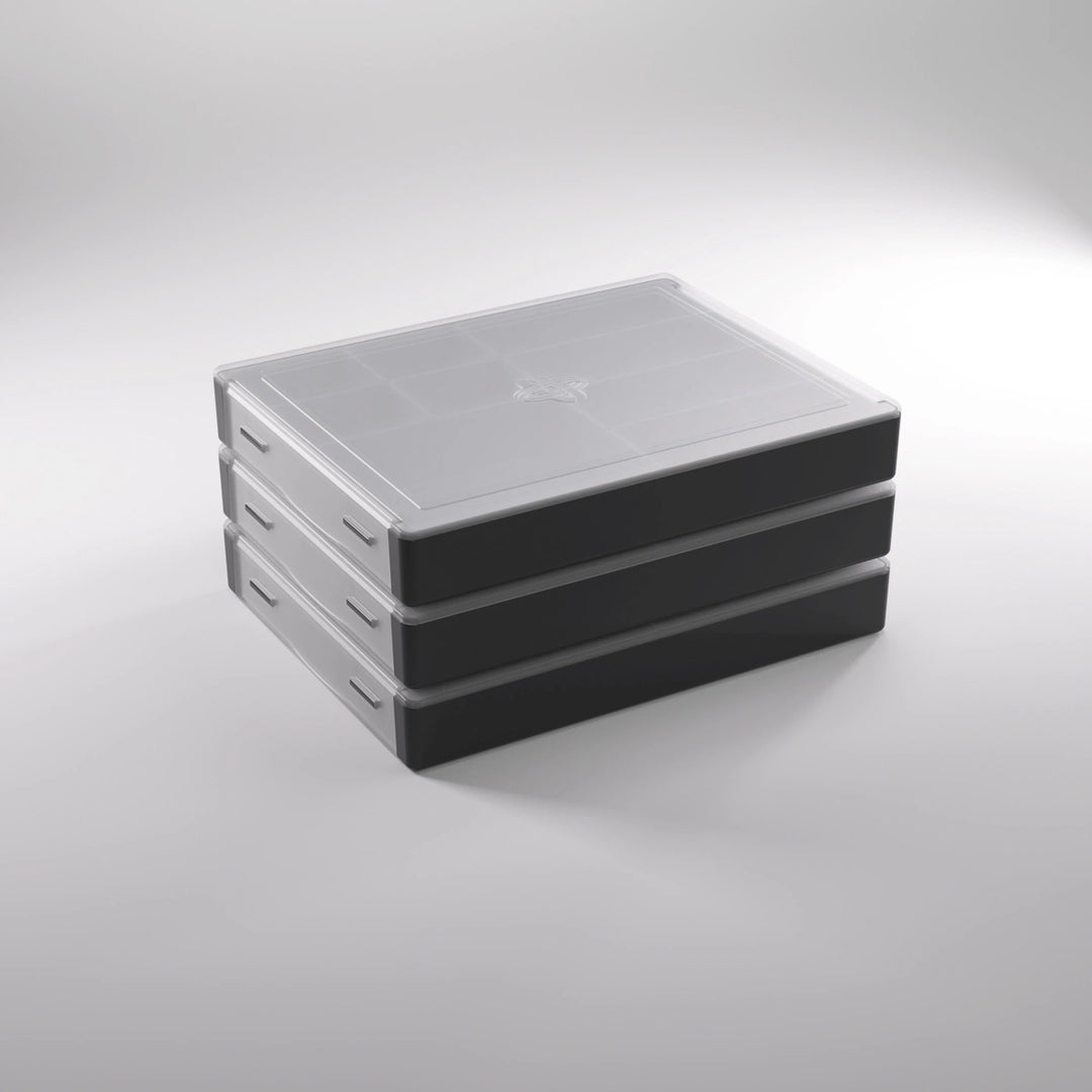 A photo of a stack of three, black, plastic containers with clear lids on a white background.