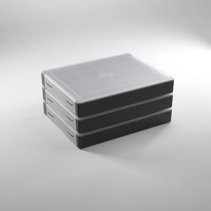 A photo of a stack of three, black, plastic containers with clear lids on a white background.
