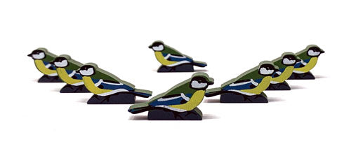 Eight identical, painted, wooden tokens of a Great Tit, for use with the board game Wingspan.