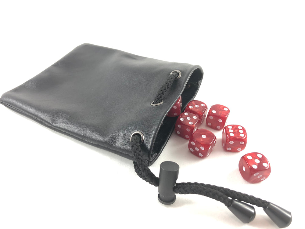 A black leather bag, with a drawstring on one side of the opening and a tumble of dark red dice coming out of the bag.
