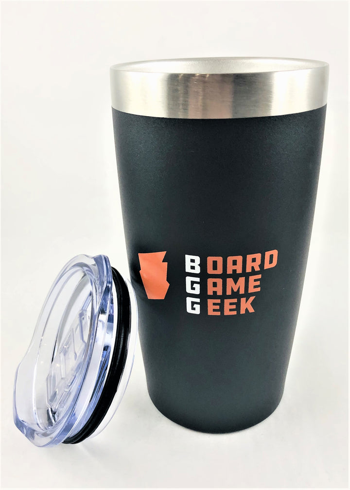 A black and silver travel mug, with a clear, push top resting on the side. The mug is decorated with an orange logo and the words "BoardGameGeek".