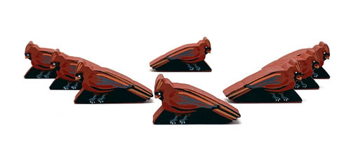 Eight identical, painted, wooden tokens of a cardinal, for use with the board game Wingspan.