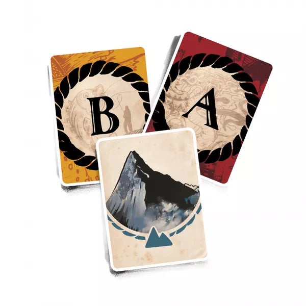 Three example cards from the board game Balada, showing the letter B on a gold background, the letter A on a red background, and an illustration of a mountain.